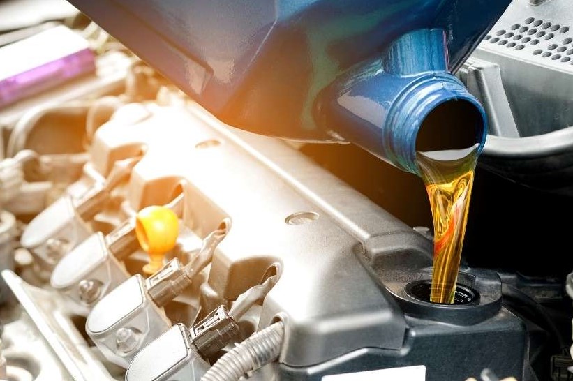 Oil being poured into Fleet car